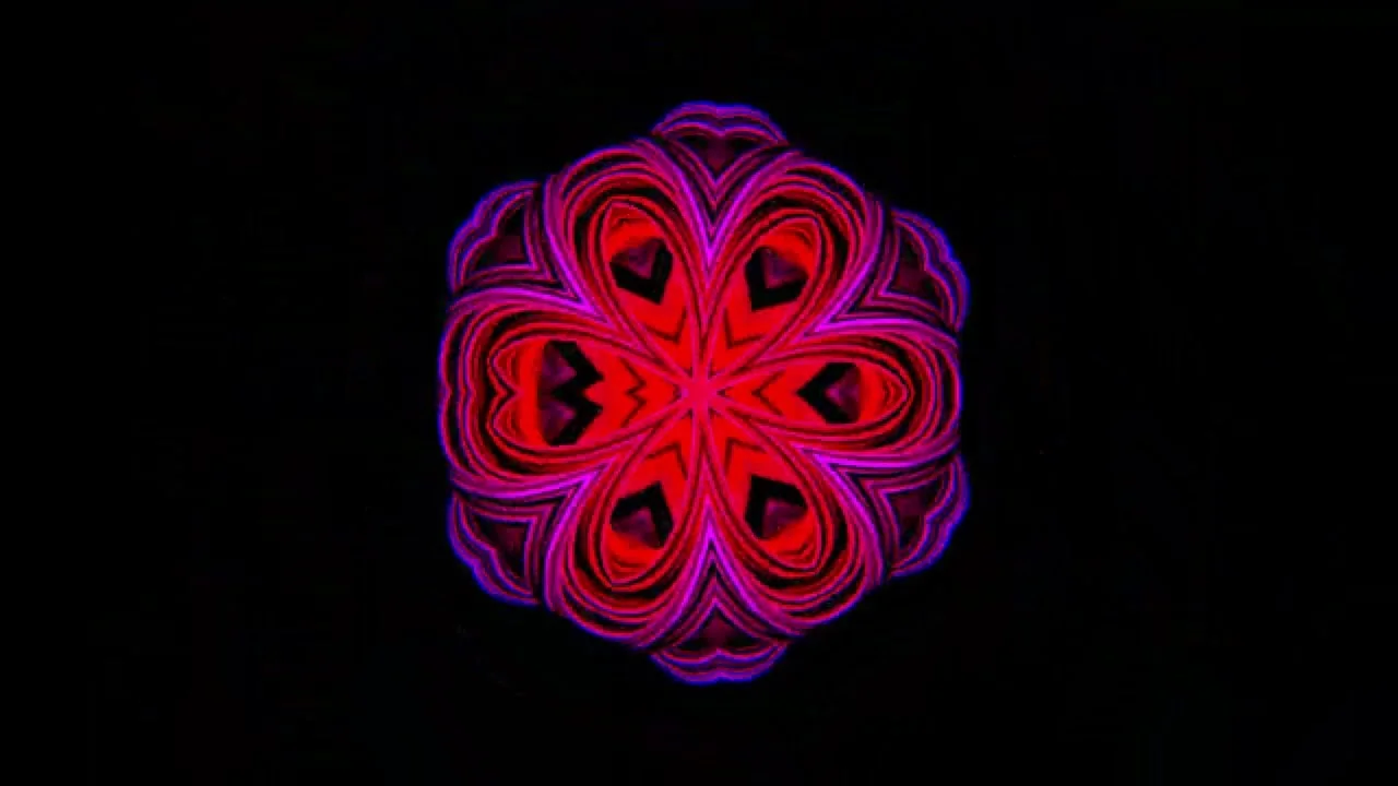 Still from Alien Contact: a six-fold red and magenta mandala unfolding on black